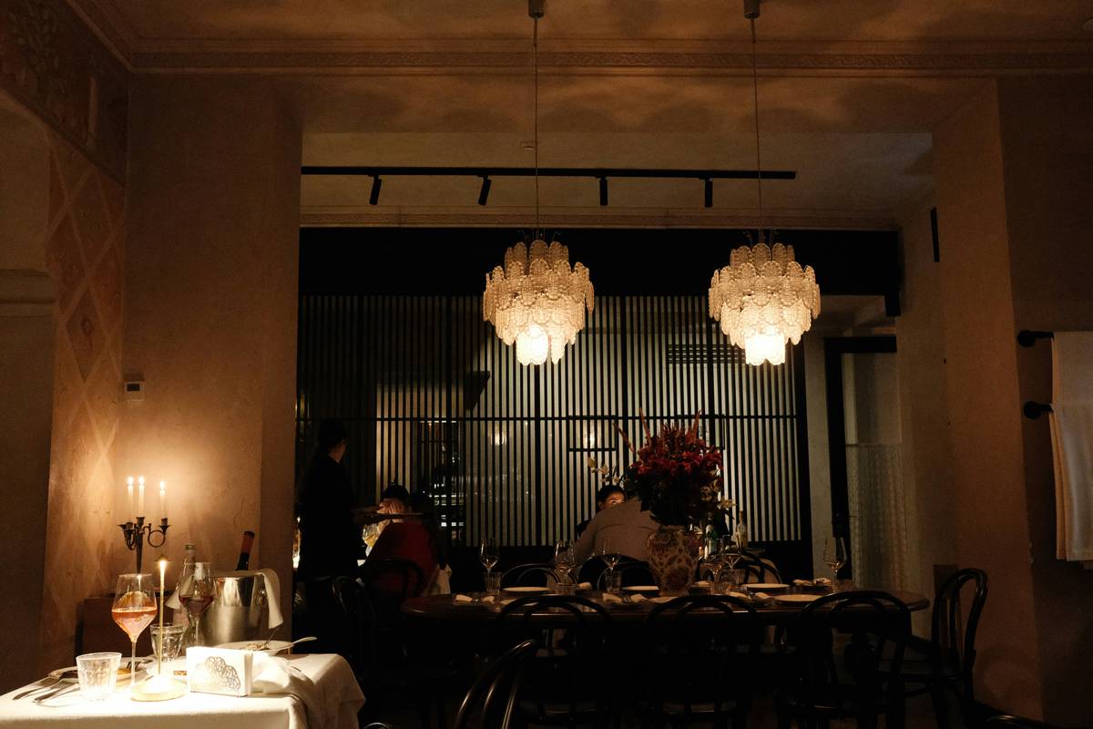 restaurant in my mood with warm pendant lights over dining tables
